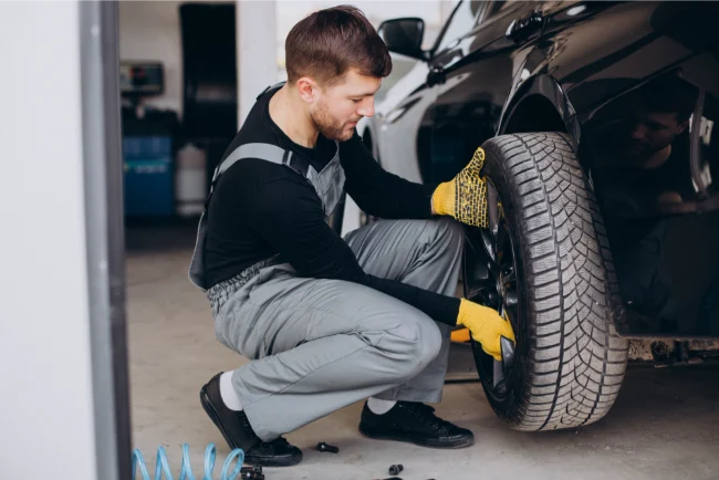 BRS Tyres - Mechanic Changing Car Wheels